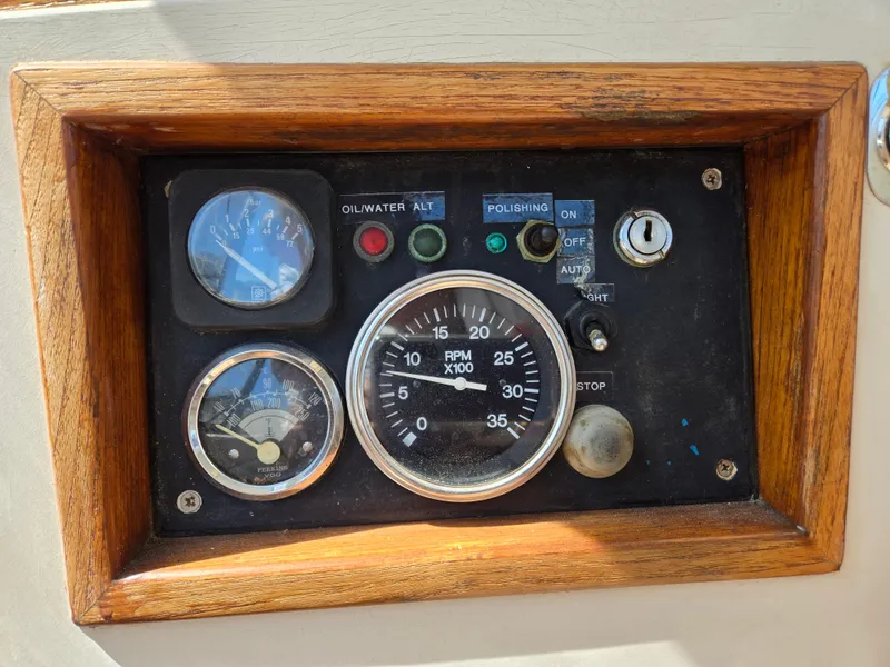 Slide: The Image of Control panel of a 1985 Amel Maramu sailboat with gauges and switches. - 5