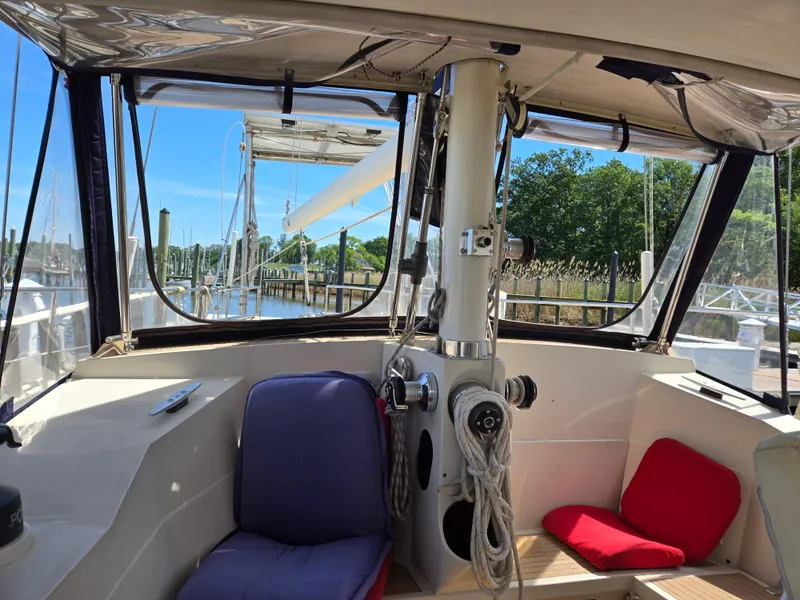 Slide: The Image of Interior view of 1985 Amel Maramu sailboat cockpit with seating and ropes. - 8