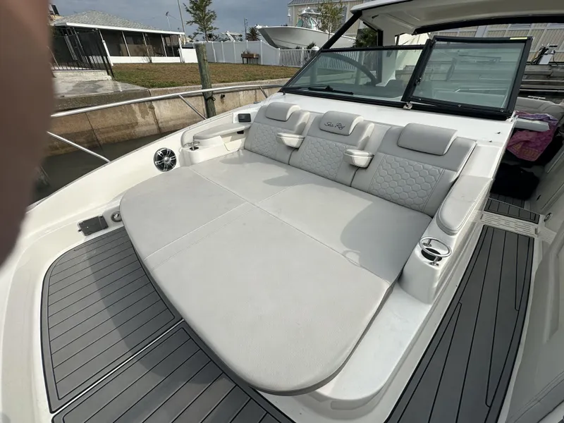 Slide: The Image of 2021 Sea Ray Sundancer 320 OB boat with spacious rear seating and modern design. - 12