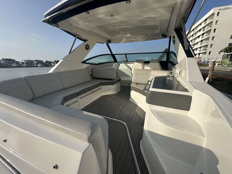 Slide: The Image of Luxurious 2021 Sea Ray Sundancer 320 OB boat interior with spacious seating and sleek design. - 4