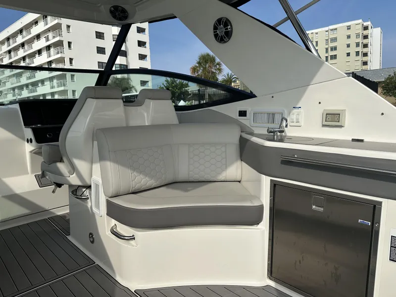 Slide: The Image of 2021 Sea Ray Sundancer 320 OB interior with modern seating and sleek design. - 6