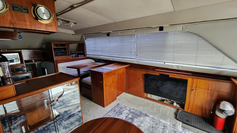 Slide: The Image of Interior of 1989 Ocean Yachts 55, featuring wood cabinetry and seating area. - 6