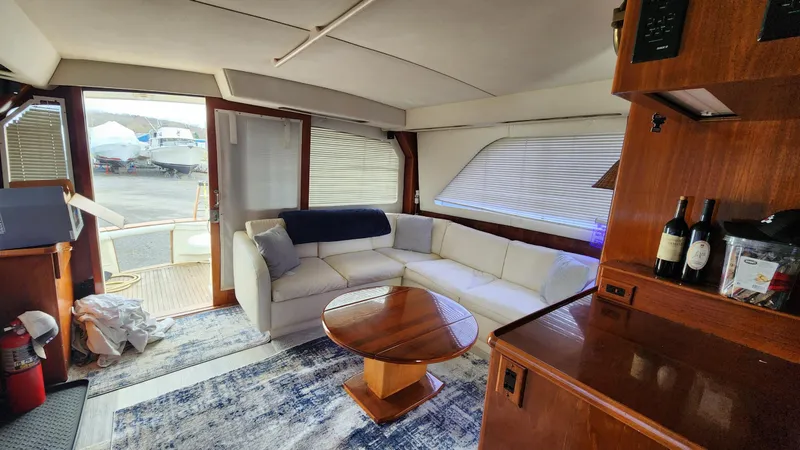 Slide: The Image of Luxurious interior of 1989 Ocean Yachts 55 with white sofa and wooden accents. - 7