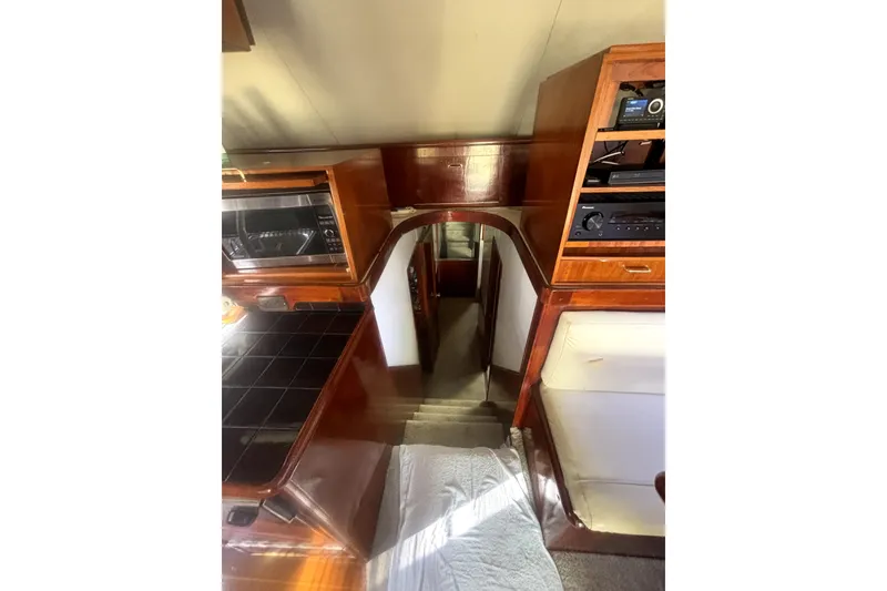 Slide: The Image of Interior view of 1989 Ocean Yachts 55 Super Sport, featuring wood cabinetry and appliances. - 30