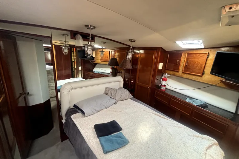 Slide: The Image of Luxurious cabin interior of 1989 Ocean Yachts 55 Super Sport with wood finishes. - 35