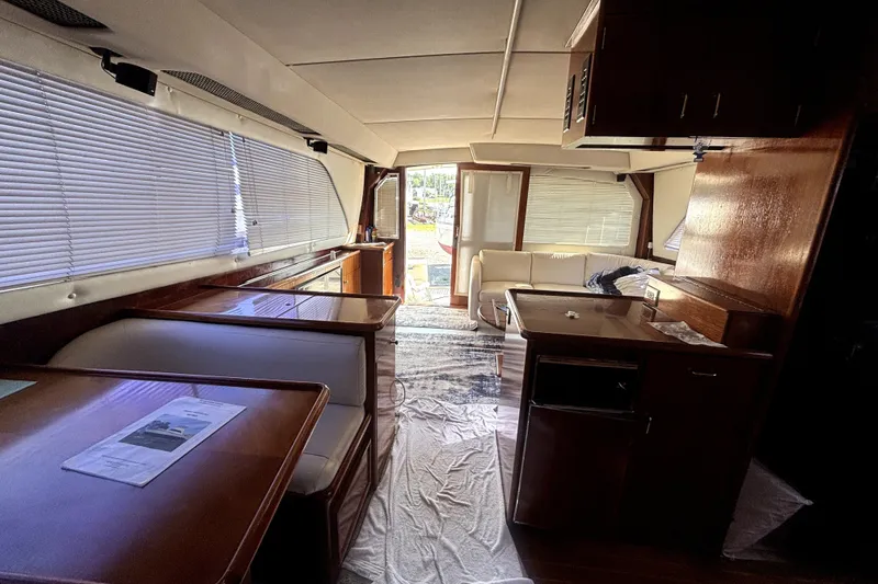 Slide: The Image of Interior of 1989 Ocean Yachts 55 Super Sport with wood finishes and seating area. - 21