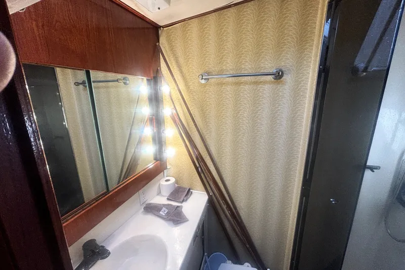 Slide: The Image of Bathroom interior of 1989 Ocean Yachts 55 Super Sport with mirror and lighting. - 33