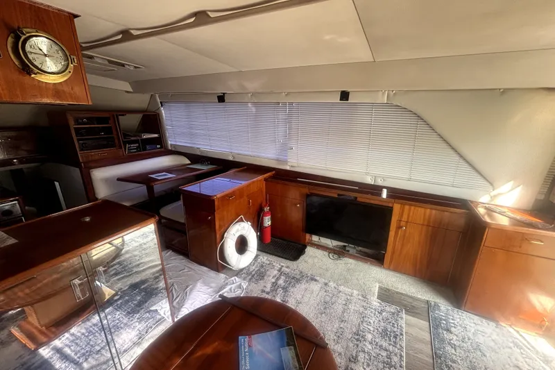 Slide: The Image of Interior of 1989 Ocean Yachts 55 Super Sport with wood cabinetry and nautical decor. - 28