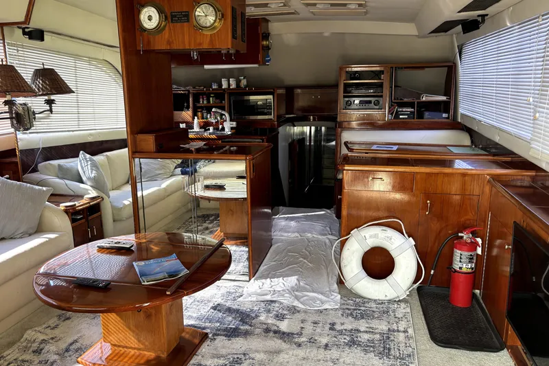 Slide: The Image of Luxurious interior of a 1989 Ocean Yachts 55 Super Sport with elegant wood finishes. - 23