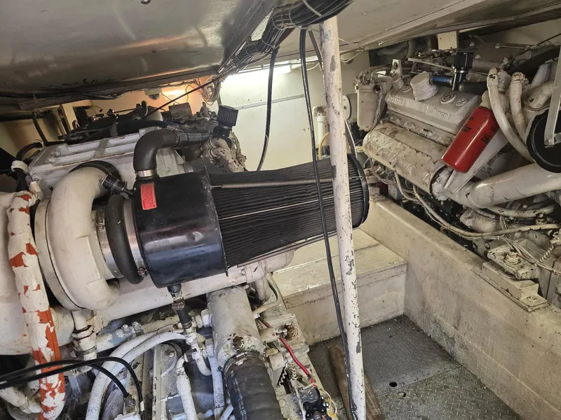 Slide: The Image of Engine room of a 1989 Ocean Yachts 55, showcasing dual diesel engines. - 17