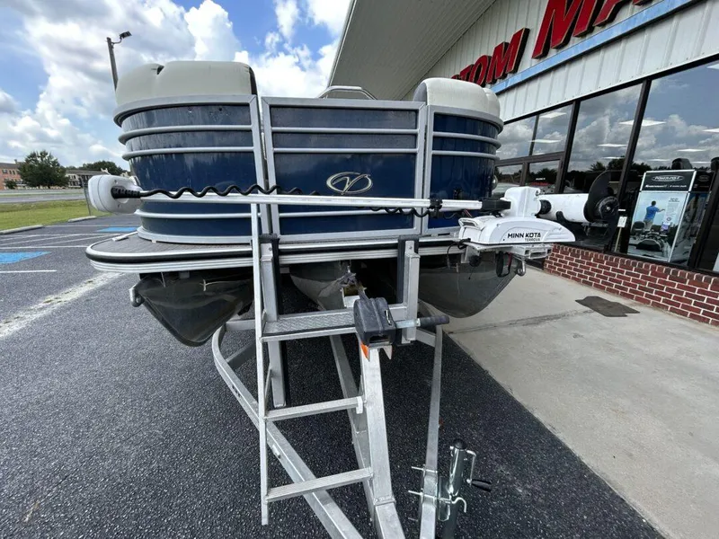 Slide: The Image of 2020 Veranda VP22VLC pontoon boat parked outside a store. - 13