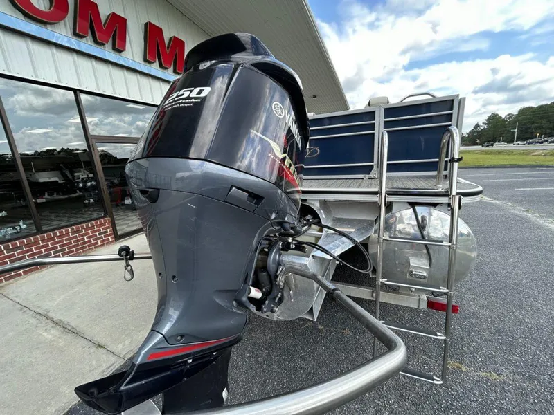 Slide: The Image of 2020 Veranda VP22VLC with outboard motor in parking lot. - 3