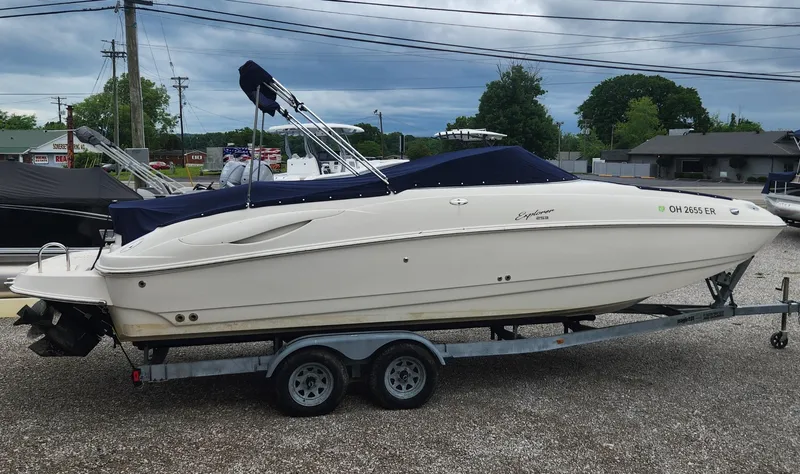 Slide: The Image of 2003 Monterey 253 Explorer Sport boat on trailer, parked outdoors. - 11