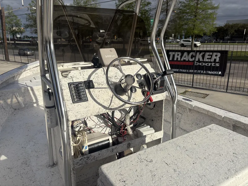 Slide: The Image of Skiff Reno 23 boat with Mercury OptiMax engine, 2000 model, under clear blue sky. - 5