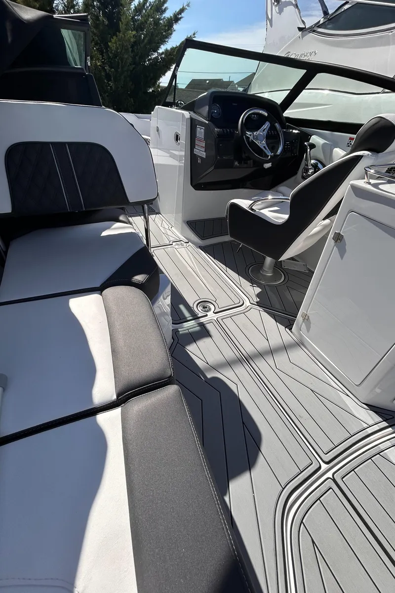 Slide: The Image of 2025 Monterey M65 boat interior with sleek seating and modern dashboard design. - 4