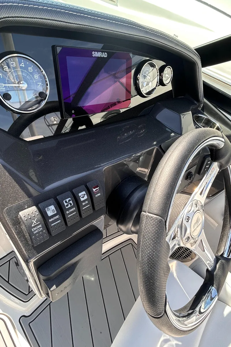 Slide: The Image of Dashboard of 2025 Monterey M65 boat with steering wheel and digital display. - 5