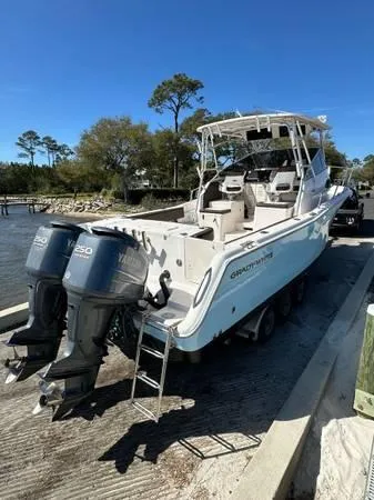 Slide: The Image of 2005 Grady-White Marlin 300 boat with twin Yamaha engines on a sunny day. - 4