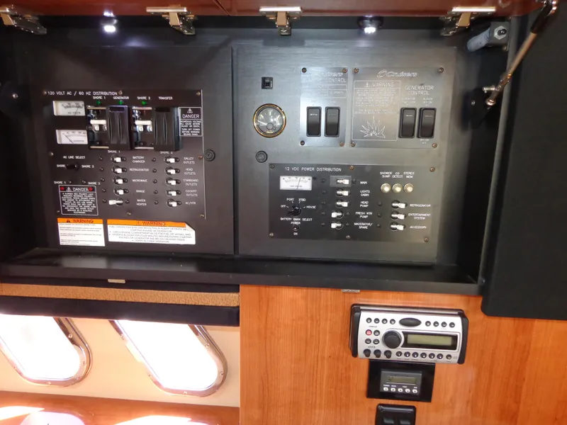 Slide: The Image of Electrical panel inside 2008 Cruisers Yachts 330 Express, featuring switches and controls. - 19
