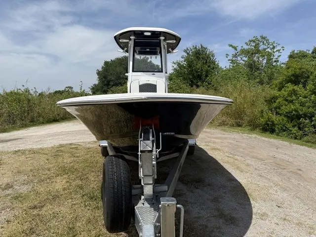Slide: The Image of 2024 Tidewater 2410 Bay Max boat on trailer, parked outdoors on a sunny day. - 10