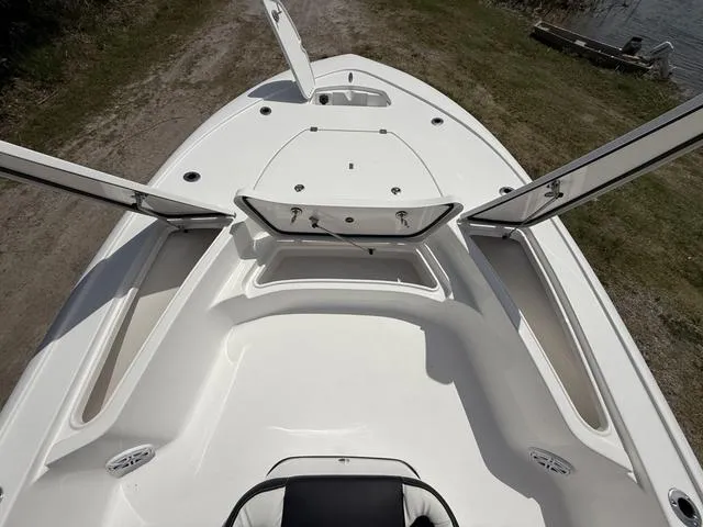 Slide: The Image of 2024 Tidewater 2410 Bay Max boat deck with open storage compartments. - 38