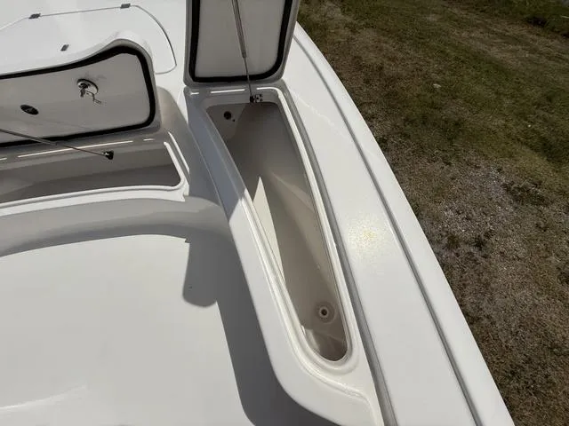 Slide: The Image of 2024 Tidewater 2410 Bay Max boat storage compartments, open on deck. - 41