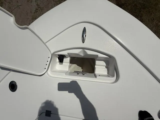 Slide: The Image of 2024 Tidewater 2410 Bay Max boat deck with open storage compartment. - 43