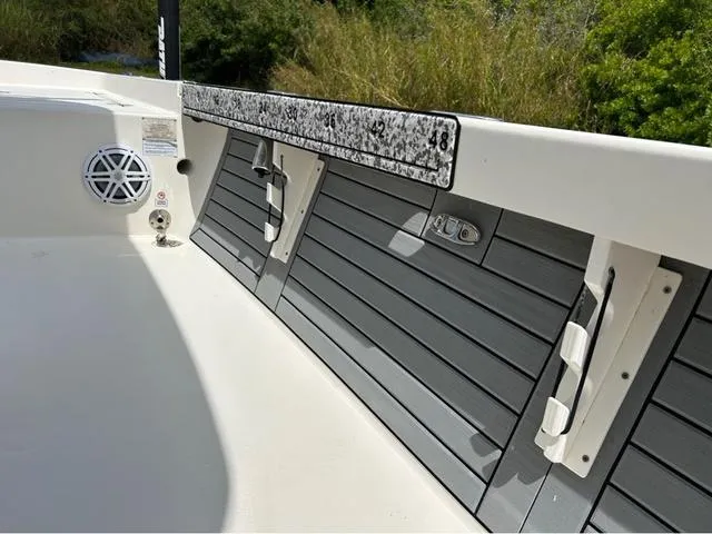 Slide: The Image of 2021 Pathfinder 2600 HPS boat interior with speaker and rod holders, featuring sleek design elements. - 11