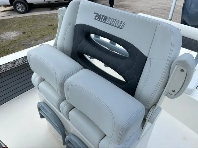 Slide: The Image of 2021 Pathfinder 2600 HPS boat seat with gray upholstery and logo detail. - 13
