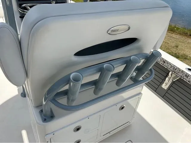 Slide: The Image of 2021 Pathfinder 2600 HPS boat seat with rod holders and storage compartments. - 15