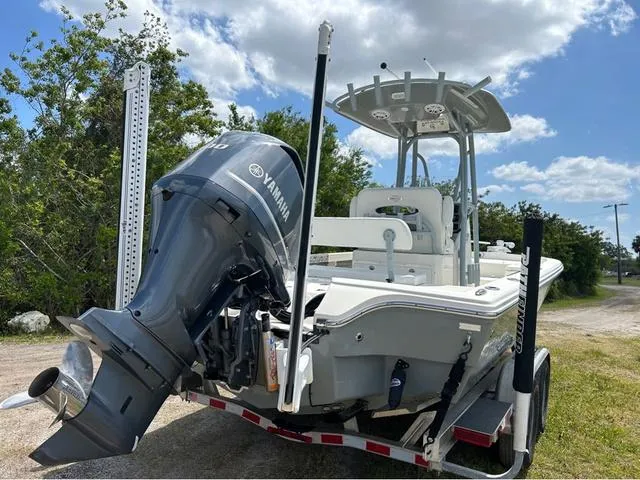 Slide: The Image of 2021 Pathfinder 2600 HPS boat with Yamaha engine on trailer, outdoors. - 4