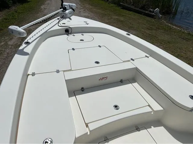 Slide: The Image of 2021 Pathfinder 2600 HPS boat deck with storage compartments and trolling motor. - 7