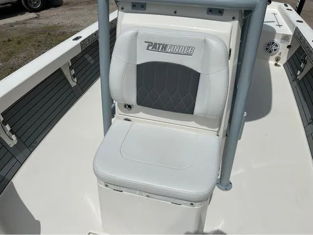 Slide: The Image of 2021 Pathfinder 2600 HPS boat seat with logo, featuring white and gray upholstery. - 8