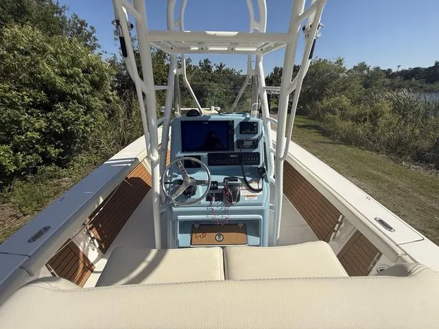 Slide: The Image of 2023 Pathfinder 2700 Open boat interior with steering console and navigation equipment. - 11