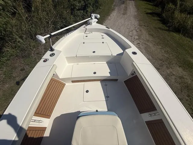 Slide: The Image of 2023 Pathfinder 2700 Open boat deck with storage compartments and seating. - 16