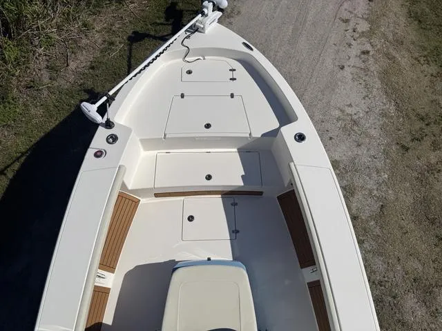 Slide: The Image of 2023 Pathfinder 2700 Open boat deck with storage compartments and seating. - 17
