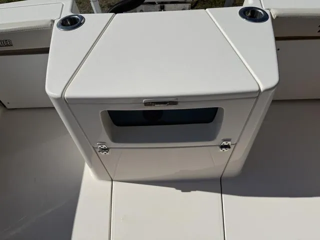 Slide: The Image of 2023 Pathfinder 2700 Open boat console with cup holders and storage compartment. - 28