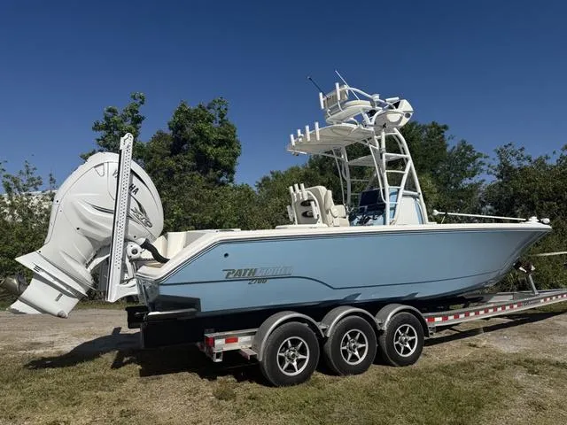 Slide: The Image of 2023 Pathfinder 2700 Open boat on trailer, featuring dual engines and sleek design. - 3