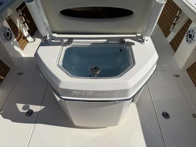 Slide: The Image of 2023 Pathfinder 2700 Open boat deck with livewell and rod holders. - 32