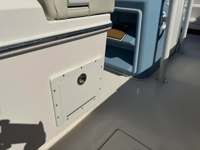 Slide: The Image of 2023 Pathfinder 2700 Open boat interior with storage compartment and seating. - 38