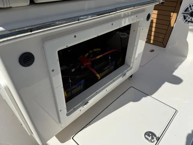 Slide: The Image of Battery compartment of 2023 Pathfinder 2700 Open boat, showing wiring and connections. - 43