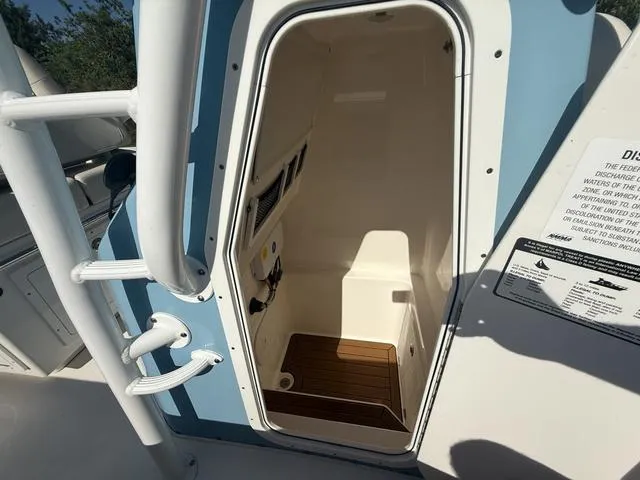Slide: The Image of 2023 Pathfinder 2700 Open boat interior with open hatch and wooden flooring. - 45