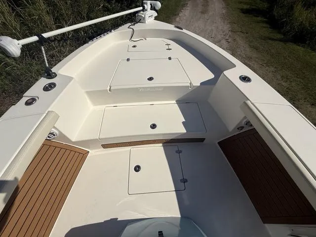 Slide: The Image of 2023 Pathfinder 2700 Open boat deck with storage compartments and seating. - 48