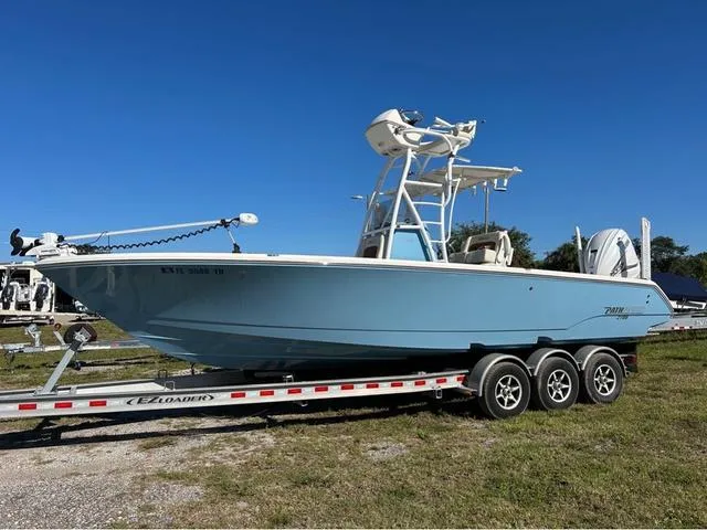 Slide: The Image of 2023 Pathfinder 2700 Open boat on trailer, side view, clear sky background. - 5