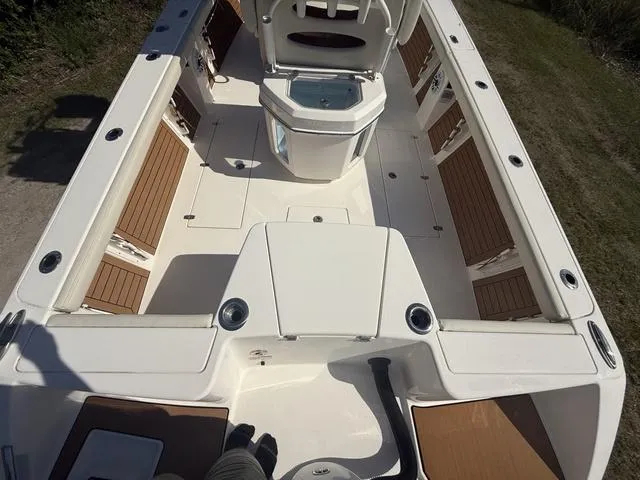 Slide: The Image of 2023 Pathfinder 2700 Open boat interior with seating and storage compartments. - 8