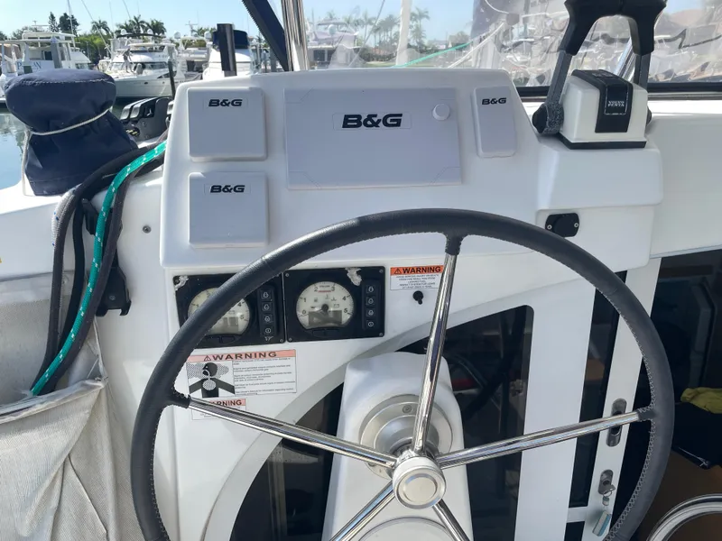 Slide: The Image of Helm of 2016 Lagoon 380 catamaran with B&G navigation system and steering wheel. - 13