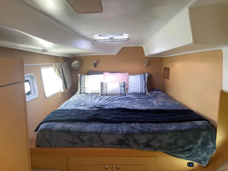 Slide: The Image of Cozy cabin interior of 2016 Lagoon 380 catamaran with comfortable bedding and natural light. - 23