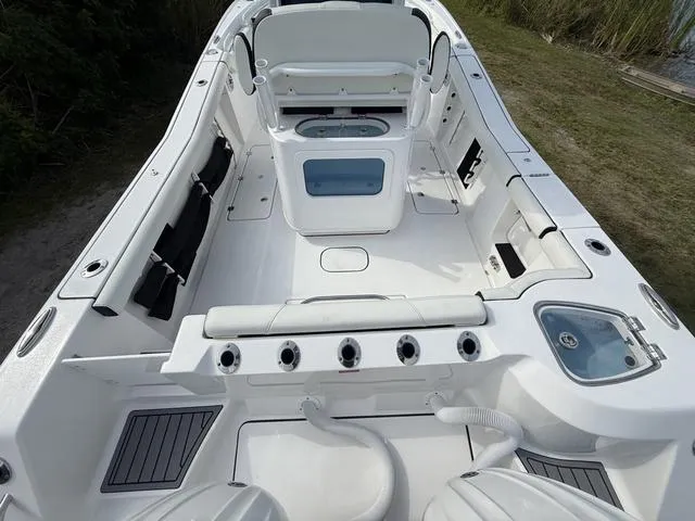 Slide: The Image of 2024 Tidewater 256 CC Adventure boat interior, featuring spacious seating and modern amenities. - 13