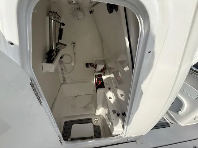 Slide: The Image of 2024 Tidewater 256 CC Adventure boat interior, featuring storage and equipment compartments. - 42