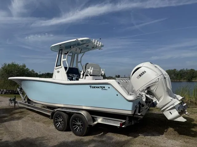 Slide: The Image of 2024 Tidewater 256 CC Adventure boat on trailer, featuring Yamaha outboard motor. - 8