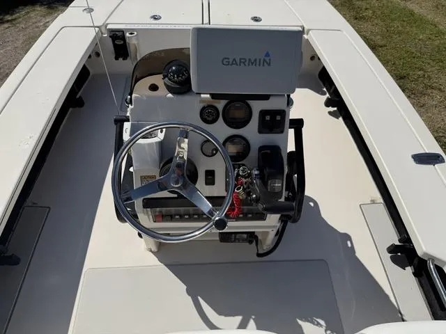 Slide: The Image of 2009 Hewes 18 Redfisher boat console with Garmin navigation system and steering wheel. - 12